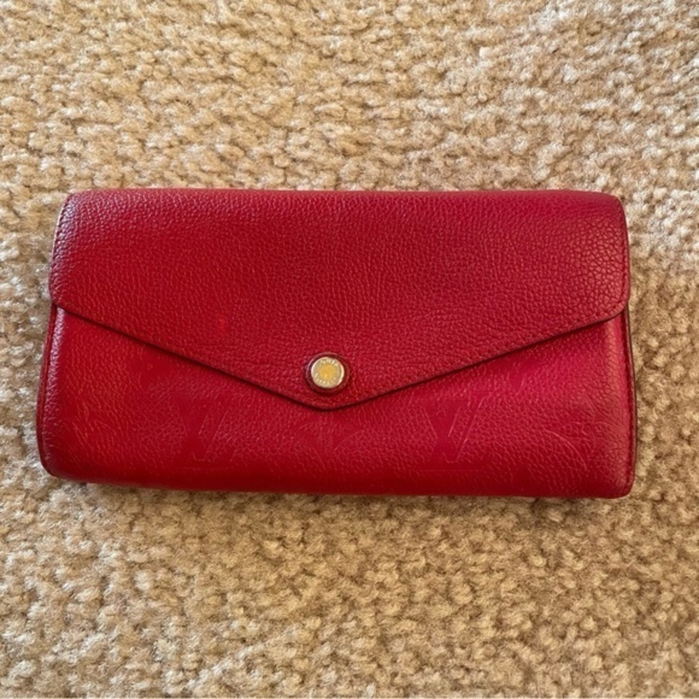 LOUIS VUITTON
Monogram Empreinte Leather Sarah Wallet